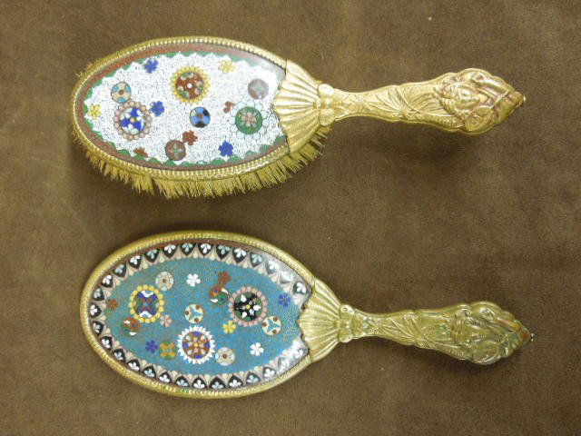 2 Chinese Cloisonne Dresser Pieces: Two Chinese cloisonne paneled dresser pieces, both with brass Art Nouveau female figural handles, includes: 8 3/4" brush and 9 5/8" hand mirror, early 20th C. CONDITION: No issues identified.