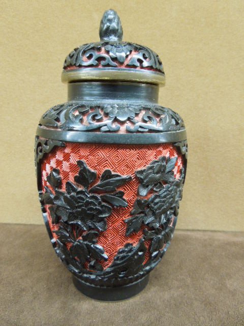 Chinese Lacquered Covered Vase: Chinese lacquered covered vase relief carved in black and cinnabar, with scrolls and flowers; enameled interior and base, height 6 1/4", 20th C.