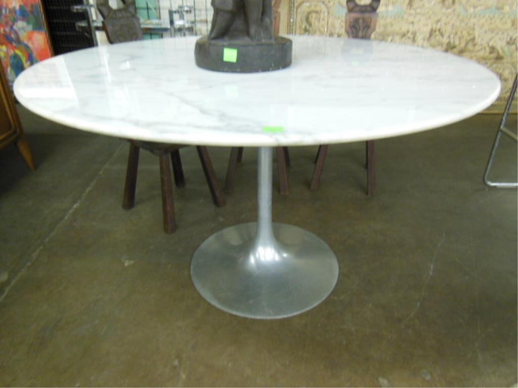 1960's Eero Saarinen Tulip Dining Table: 1960's Eero Saarinen tulip dining table, by Knoll 48" diameter; white marble top. CONDITION: No issues identified.
