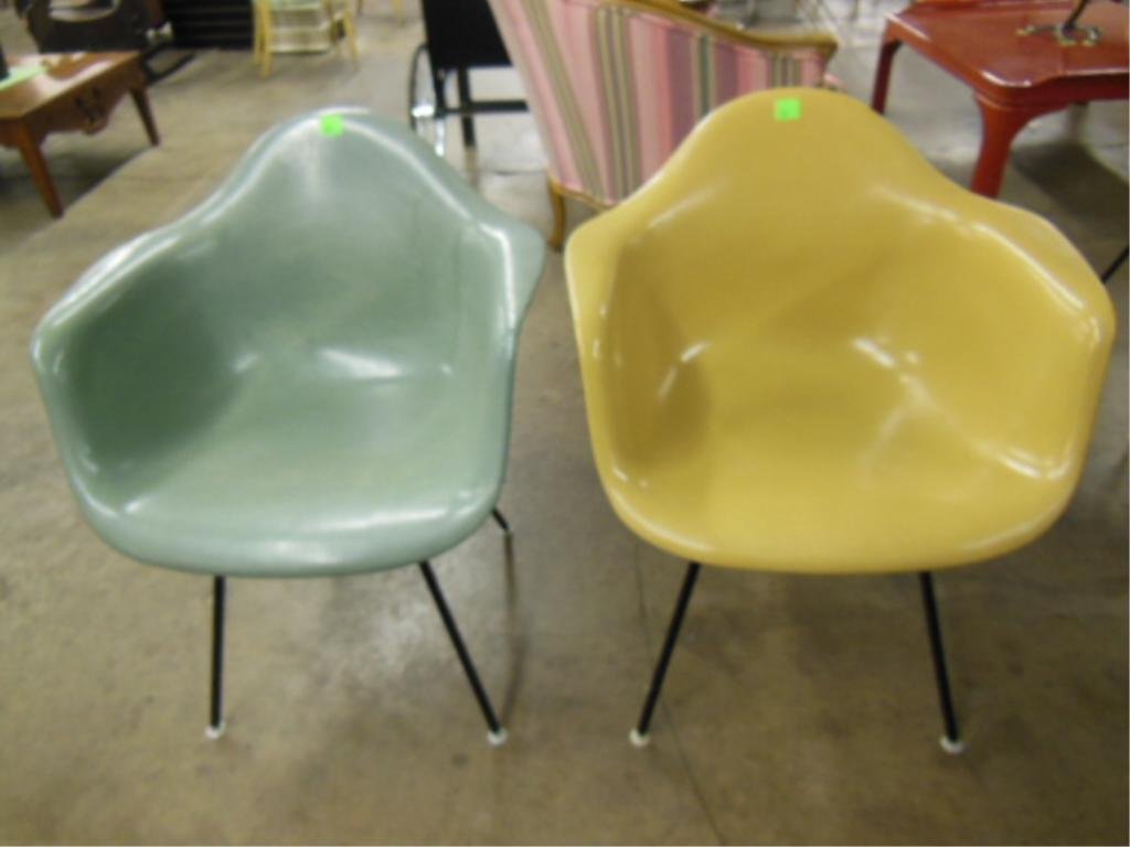 Pr Mid-Century Eames For Miller Chairs: Pair, original Mid-century Modern Charles Eames for Herman Miller, fiberglass shell chairs, the one green and the other mustard yellow. [Both retain Herman Miller labels] [Note: green chair retains st