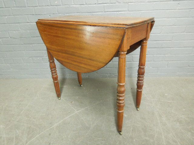 Victorian Petite Drop Leaf Table: Victorian petite drop leaf table, walnut, demi lune drop leaves, single drawer, turned legs on casters, late 19th c. 28 3/4" x 26 3/4" x 14 1/2". CONDITION: Rings & wear to table top.