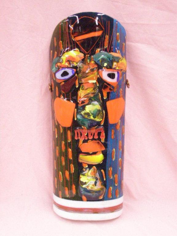 Contemporary Art Glass Face Mask: Unsigned contemporary art glass 21 3/4" x 8" face mask wall sculpture with applied coiled copper ears, attributed to Aksei Mortensen. CONDITION: Very good with no damage.