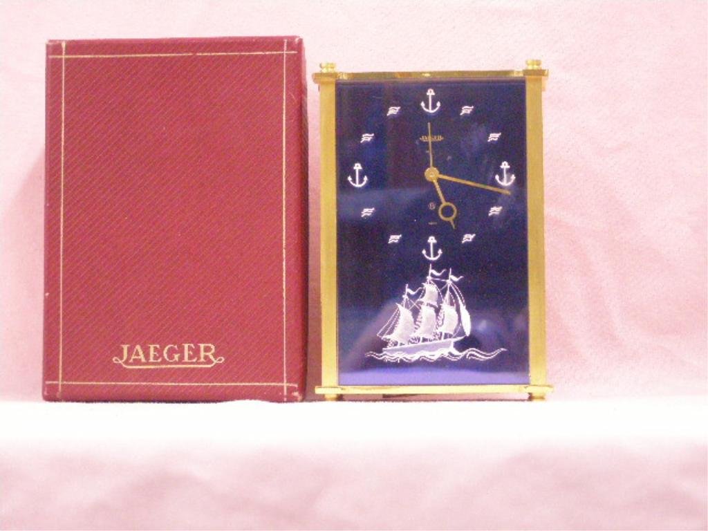 1960's Jaeger Musical Alarm Clock: 1960's Jaeger Swiss "La Traviata" 5" x 3 1/2" x 1 1/2" musical 8 day alarm clock with original box. CONDITION: Not working, scratches on lucite front plate, box has tearing.