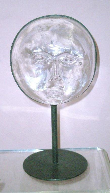 Kosta Boda Glass Face Sculpture: 1970's Kosta Boda Erik Hoglund designed 10 1/2" glass face sculpture set into a black metal stand. CONDITION: Very good with wear on metal stand.