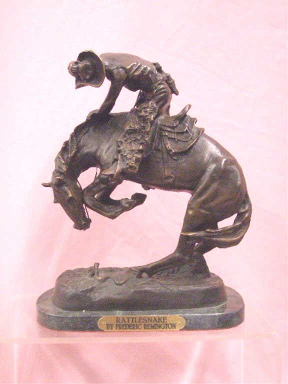 Frederic Remington Rattlesnake Bronze Statue: Contemporary Frederic Remington 11" x 9" Rattlesnake bronze statue on green marble base. CONDITION: Very good with minor wear and no damage.