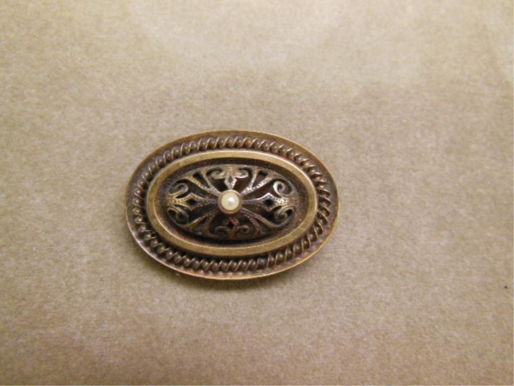 Edwardian 14k Pin: Edwardian 14k pin, 14k yellow gold (tested) in four oval tiers of rope twist and bands crested by a scroll reticulated dome with seed pearl pinnical, late 19th C. 36 x 25 mm, 6 DWT. CONDITION: Tarnish