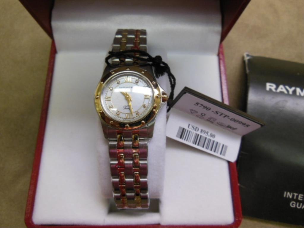 Raymond Weil Lady's Wrist Watch: Raymond Weil lady's wrist watch Geneva "Tango" collection, two tone stainless steel, model 5790, mother of pearl dial, new in box. retail value $895.00. CONDITION: New in box.
