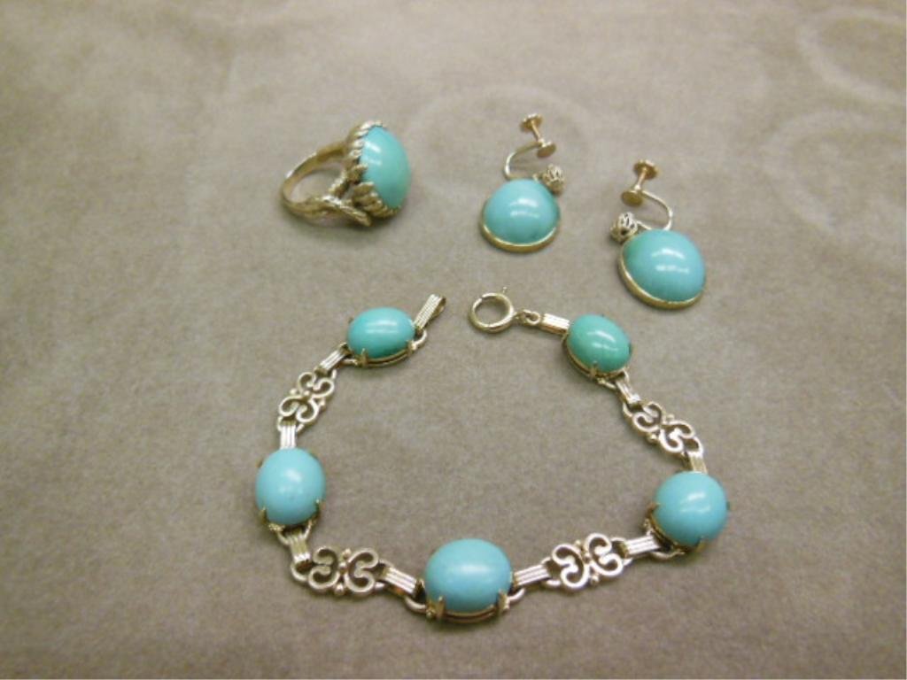 14k Turquoise Parure: 14k gold & turquoise Parure, 14k yellow gold, includes: 7" flexiable bracelet with alternating scroll & bar links with prong set oval 12" x 10"mm oval cabochon turquoise, pair screw back earrings with