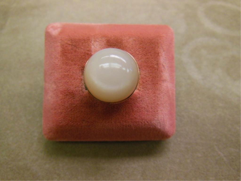 14k Large Moonstone Ring: 14k large moonstone ring, 14k yellow gold with bezel holding an approx. 17 1/2 mm cabochon moonstone, size 6 1/2, 8 DWT. [17] CONDITION: Good, normal wear, minor scratches.