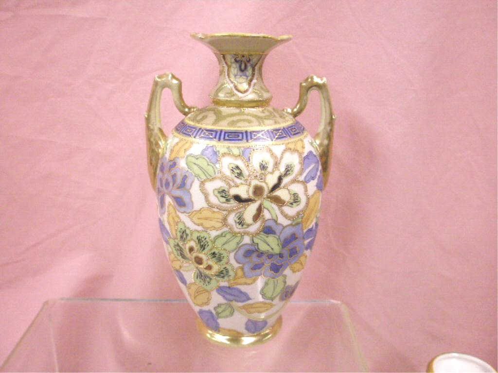 Nippon Porcelain Vase: Nippon hand painted porcelain 10" double handle vase, floral decorated with beadwork. CONDITION: Very good with minor wear and no damage.