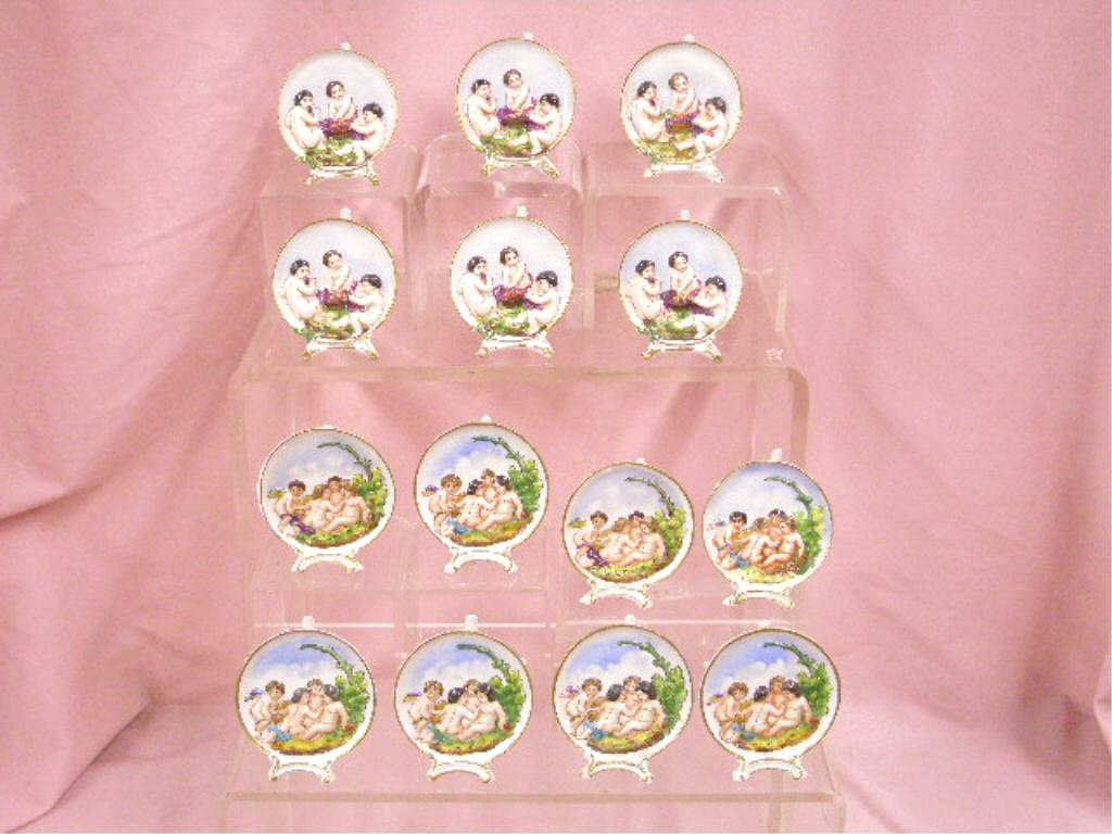 Antique Capodimonte Place Card Holders: Fourteen late 19th/early 20th c. Capodimonte porcelain 3" x 2 1/2" place card holders, round plaque with painted relief cherubs and flowers, porcelain tree branch form back stand. CONDITION: All are v