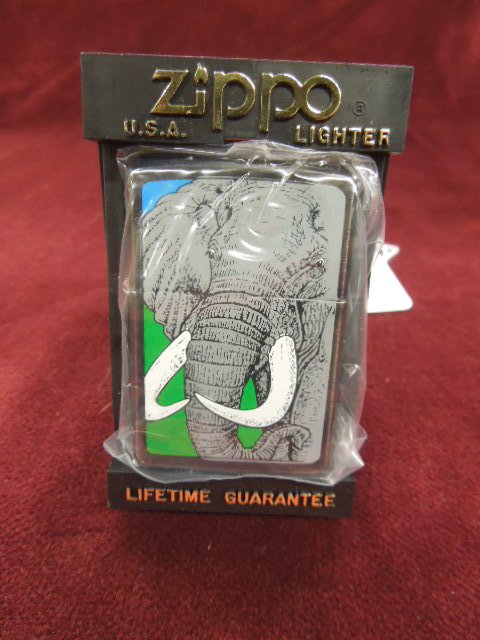 Zippo Lighter "Elephant": Zippo lighter - "Elephant", 1996, Barrett - Smythe collection, new old stock in plastic bag with plastic flip front Zippo case. CONDITION: New old stock.