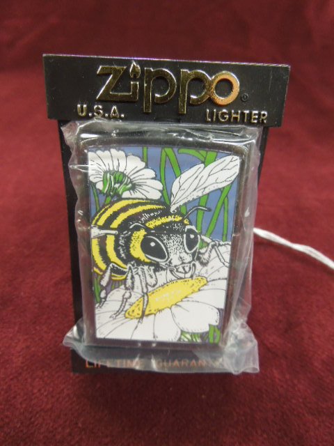 Zippo Lighter "Honey Bee": Zippo lighter - "Honey Bee", 1994, Barrett-Smythe collection "Back Yard Insects", new old stock in plastic bag with plastic Zippo flip front Zippo case. CONDITION: New old stock.