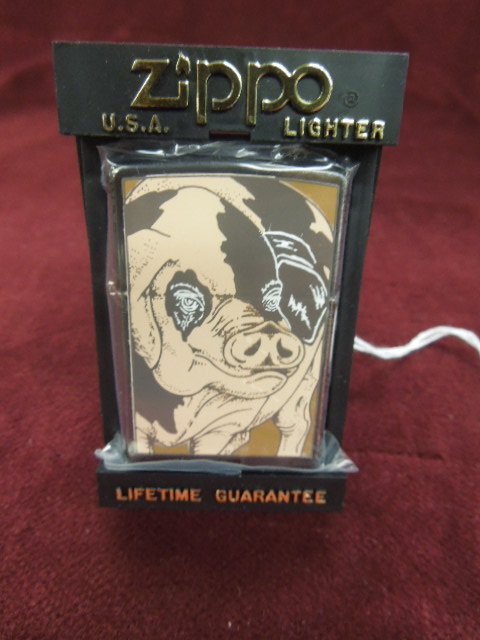Zippo Lighter "Pig": Zippo lighter - "Pig", front and backside, 90's, Barrett-Smythe collection, new old stock in plastic bag with plastic flip front Zippo case. CONDITION: New old stock.