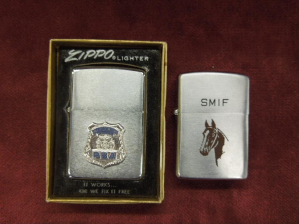 2 - Vintage Zippo Lighters: Two vintage Zippo lighters, City of New York Police, PBA with box and SMIF horse design. CONDITION: Both are non working with minor wear.