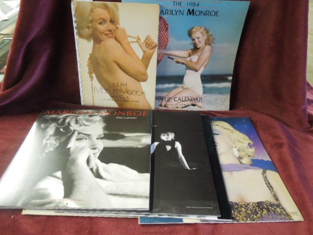 6 Marilyn Monroe calendars and datebook: 6 Marilyn Monroe calendars and datebook including; 1974 datebook w/ commentary by Norman mailer, 1983,1984,1993,1995,2003 and 2005 calendars