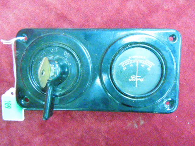 Model-T Ford Ignition Switch Bezel With Amp Gauge: Model-T Ford Ignition Switch Bezel With Amp Gauge & Key. Condition: Fair used.