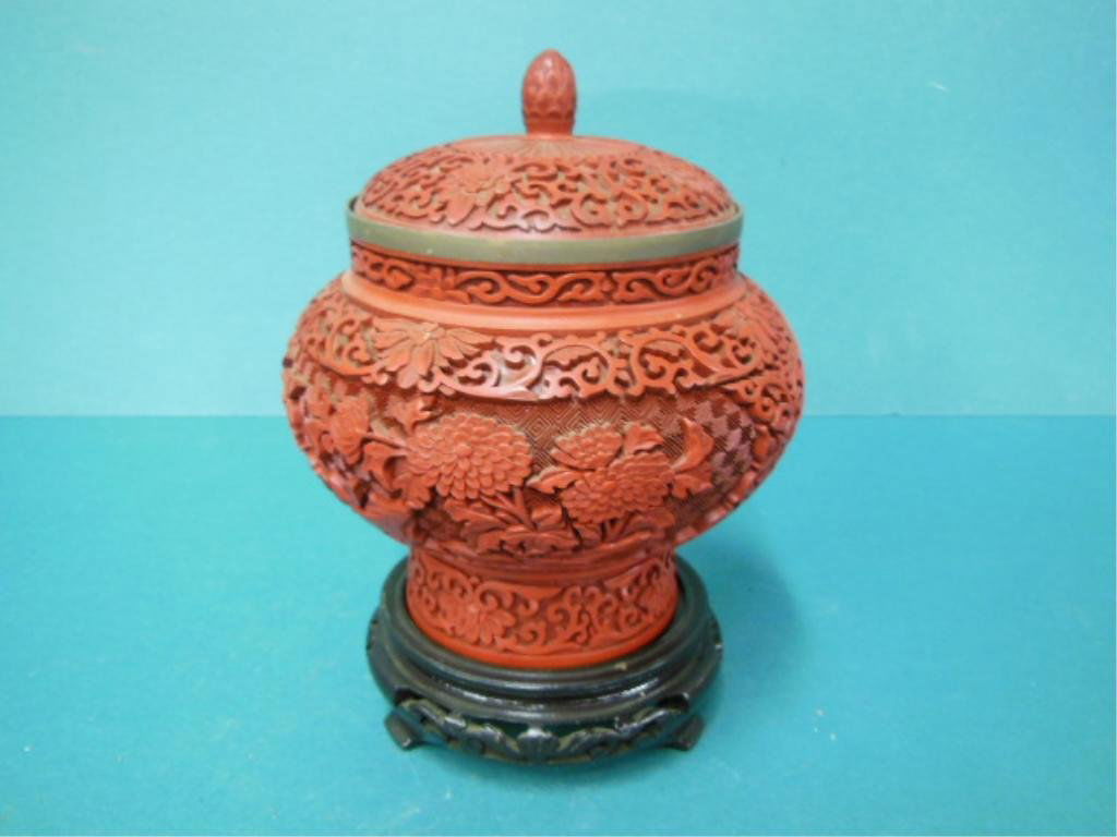 Cinnabar Ginger Jar w/ Lid: Cinnabar Ginger jar with lid, brass rim, floral and scroll design blue enamel interior, hgt 7 1/4", 20th c. CONDITION: No issues noted.