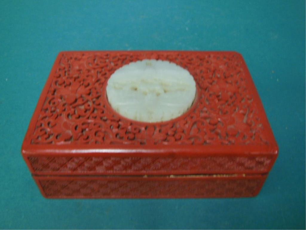 Cinnabar Box: Cinnabar box, with 2 1/4" white jade butterfly medallion, floral & scroll design, 5 5/8" x 4" x 2" x 2 1/4", 19th/20th c. CONDITION: Minor dings, & touch ups.