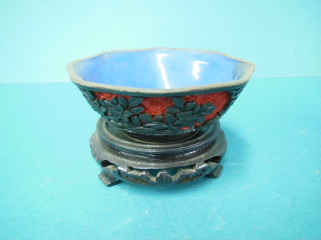 Black & Red Cinnabar Bowl Over Brass: Black & Red Cinnabar bowl over brass, blue enamel interior, floral design, 5"d x 1 7/8"h, 20th c. CONDITION: No issues noted.