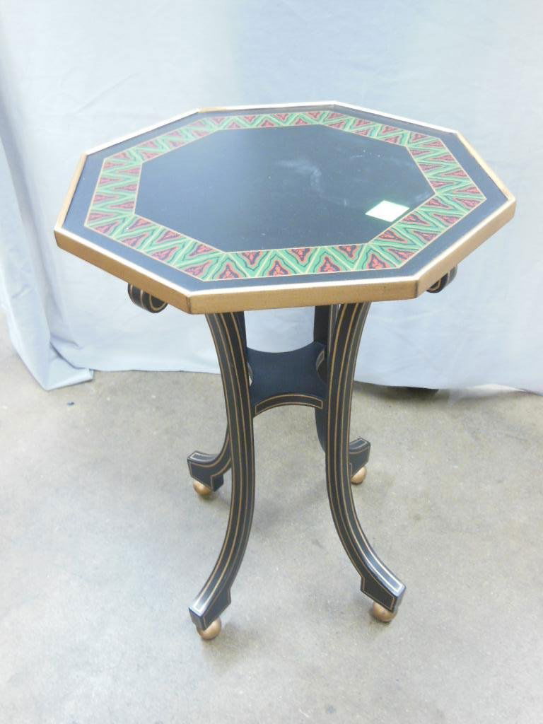 "John Widdicomb Mario Buatta Collection" Table: "John Widdicomb Mario Buatta Collection" ocassional table, in black & gold with green & red border, late 20th c. hgt 23 1/4". CONDITON: No issues noted.