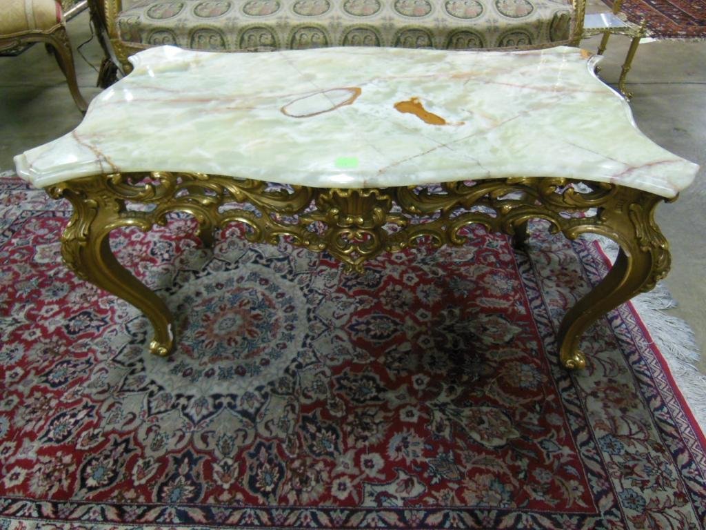 French Rococo Coffee Table: French Rococo coffee table, green & brown onyx top on a scroll & shell carved gilt wood base w/cabriole legs, early 20th C., 38 1/2" x 22 1/2" x 20". CONDITION: One corner of onyx top repaired.