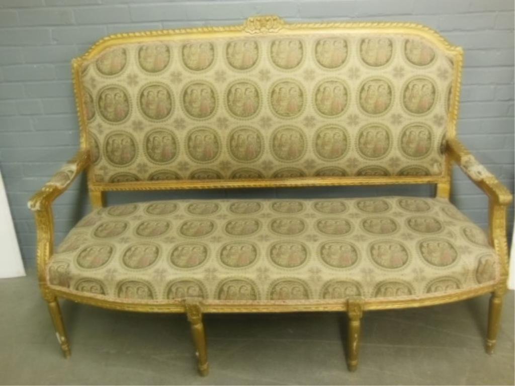 Louis XVI Style Settee: Louis XVI style settee, gilt wood frame with acanthus carvings, & turned legs, courting scene medallion tapestry type, upholstery with gold threads, 19th C., length 61". CONDITION: Loss to gold frame.
