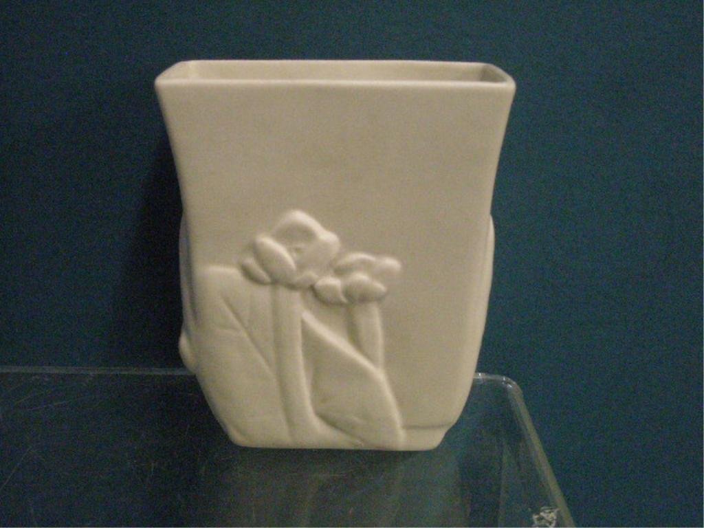 Rookwood Pottery Vase: Rookwood pottery ivory glazed #7057 production line 5 7/8" vase with molded Mallow Plants design. CONDITION: Very good with no damage.