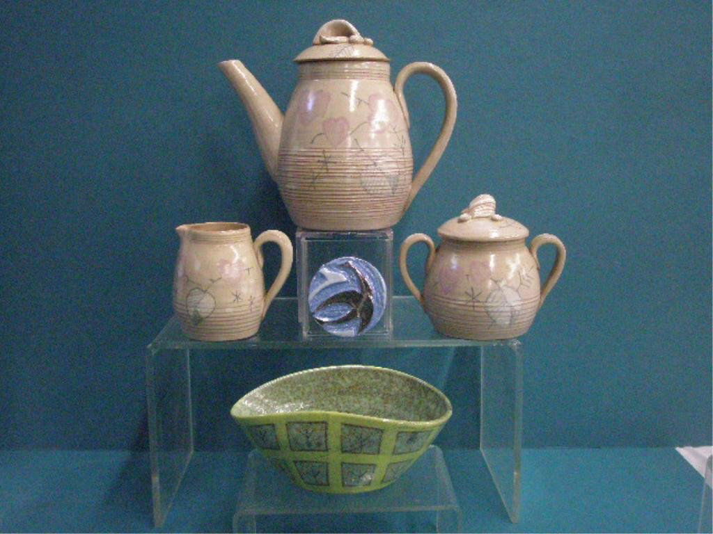 Jarko Zavi Pottery Pin, Bowl & Tea Set: Jarko Zavi signed Canadian art pottery 2" round pin with bird design, 6 1/2" x 2 1/2" x 4 1/2" bowl with geometric designs & 3 piece tea set (7" x 8" teapot, 3 1/2" creamer & 4" sugar bowl with lid) w