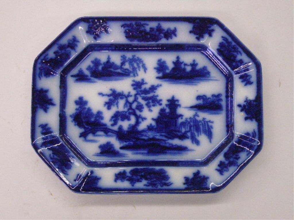 19th c. English Flow Blue Platter: Unsigned 19th c. English Flow Blue Ironstone Willow pattern 18" x 14" serving platter. CONDITION: Crazing, wear, stilt marks.
