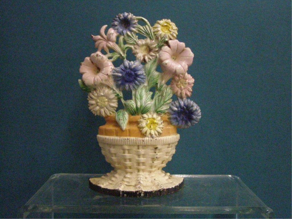 Hubley Cast Iron Floral Doorstop: Antique Hubley Manufacturing Company painted cast iron 9 1/2" x 6 1/2" #470 Petunias and Asters doorstop. CONDITION: Areas with wear, loss & or rust.