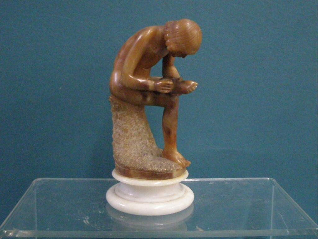 Antique Alabaster Nude Figure: Late 19th/early 20th c. Continental two tone carved Alabaster 7" figure of a seated nude female picking her foot. CONDITION: Areas with wear & scratches.