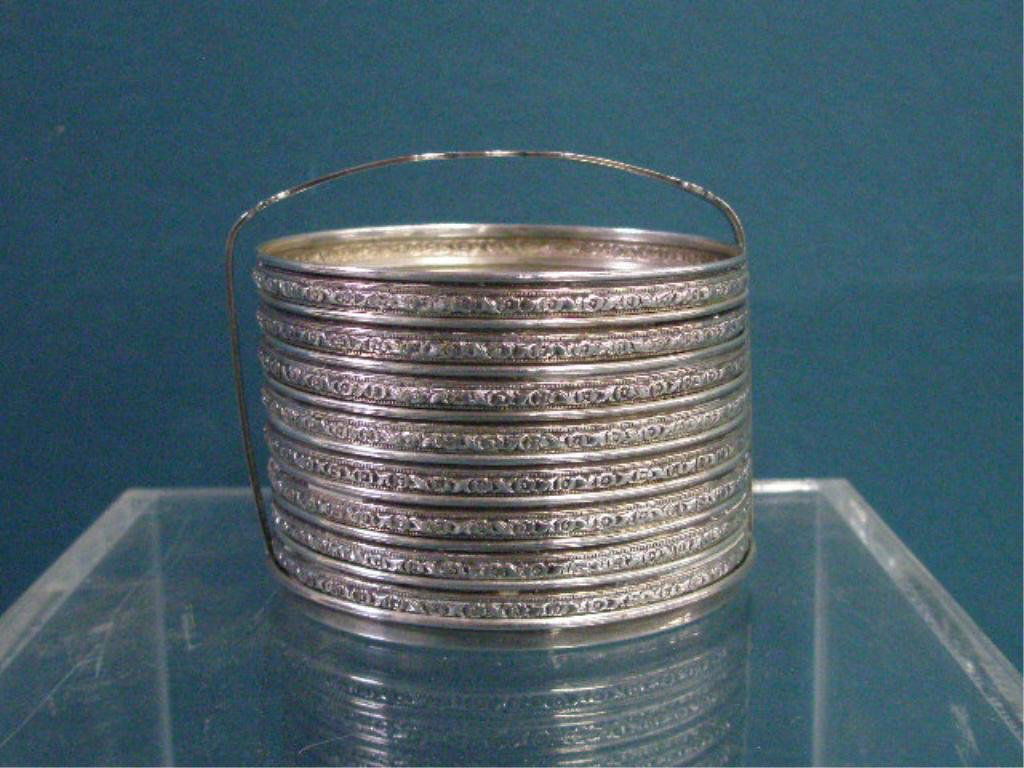 Sterling Silver Coasters With Holder: Set of eight sterling silver rim floral decorated coasters with crystal glass inset bases & holder, holder weighs .60 troy ounces. CONDITION: One coaster has cracked glass, minor wear.