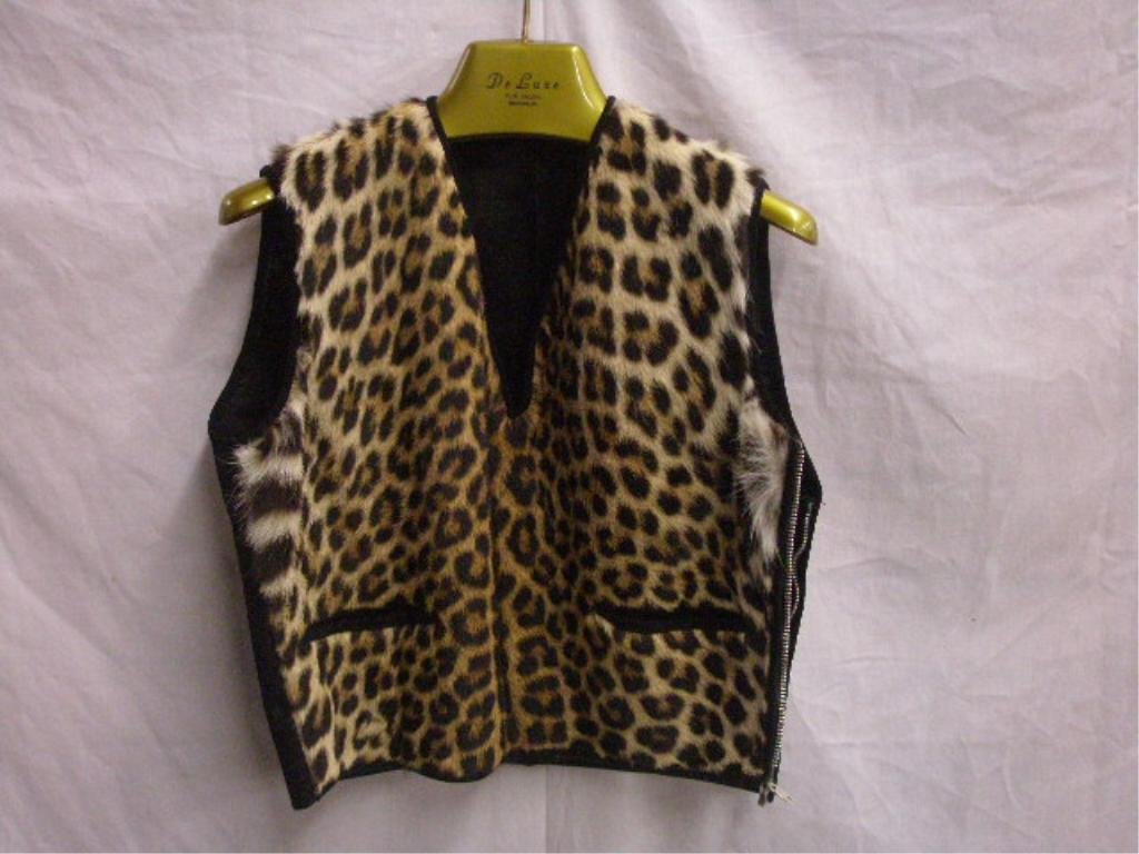 Vintage Leopard Skin Vest: Vintage Leopard skin & black ultra suede ladies vest, unknown size. [7] CONDITION: Very good with no damage.