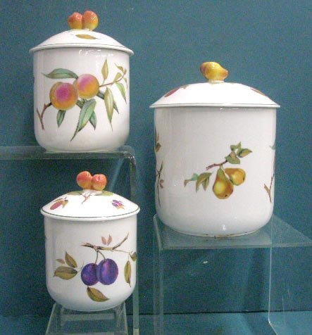 Royal Worcester Cannister Set: Royal Worcester porcelain Evesham Vale pattern 3 piece cannister set, 4 3/4" coffee, 5 7/8" sugar & 7" flour. CONDITION: All are very good with no damage.