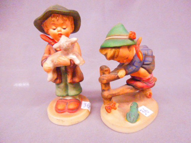 (2) Hummel "Lost Sheep" and "Retreat to Safety": (2) Hummel porcelain figures; Mk-4 "Lost Sheep", #68 2/0, 4 1/2"h and "Retreat to Safety", #201 2/0, 3 3/4"h. CONDITION: No issues noted.