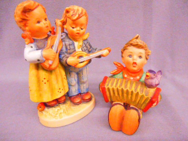 2 Hummels "Let's Sing" & "Happy Days": Two Hummel porcelain figures; "Let's Sing", # 110/0 MK-6, 3 1/4" h & "Happy Days", # 150 2/0, MK-7, 4 1/2"h. CONDITION: No issues identified.