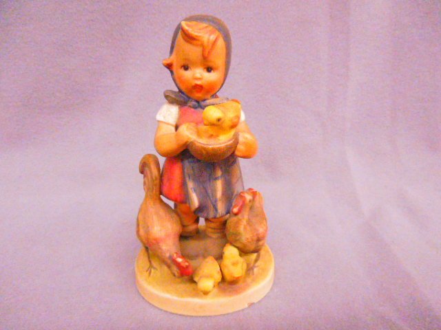 Hummel Figure "Feeding Time": Hummel porcelain figure; "Feeding Time", #199/0, MK-3, 4 1/2" h. CONDITION: Some wear from age, chip on base.
