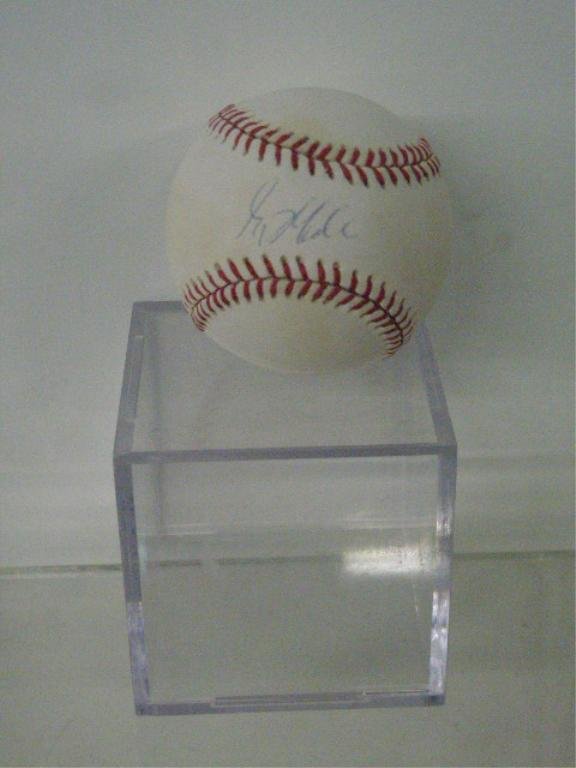 Greg Maddux Signed Baseball: Greg Maddux signed official 1995 World Series baseball with C.O.A. from Prince of Cards. CONDITION: Light signature with staining in areas on ball.