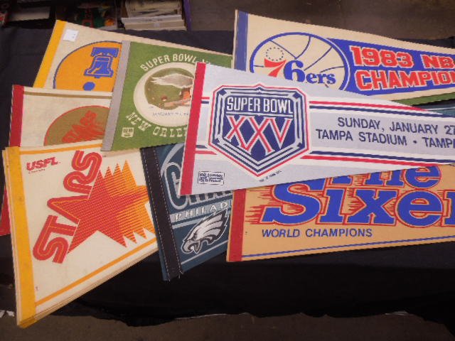 11 Professional & semi Prof. Sports Pennants: 11 Professional & semi Prof. Sports Pennants from Philadelphia Football and Basketball teams. Condition; thumb Tack holes from hanging.
