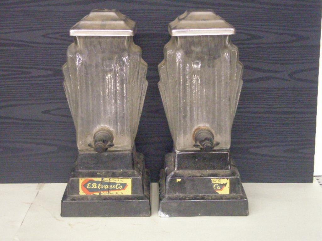 Pr. of Vintage Art Deco Soda Fountain Dispenser: Pair of Vintage Art Deco soda fountain liquid dispensers marked E.B. Evans Co. Philadelphia PA. CONDITION: Good, paper labels show damage.