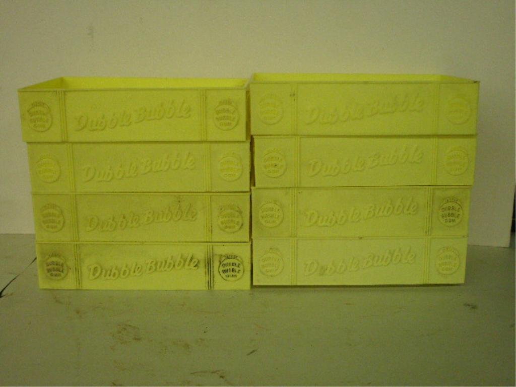 Double Bubble Stacking Containers: (8) Double Bubble Yellow plastic stacking containers with "Double Bubble" logo and name on side, "Fleer" since 1885 on edges, 7 3/4" x 4 7/8" x 1 7/8". CONDITION: Need cleaning other wise overall good