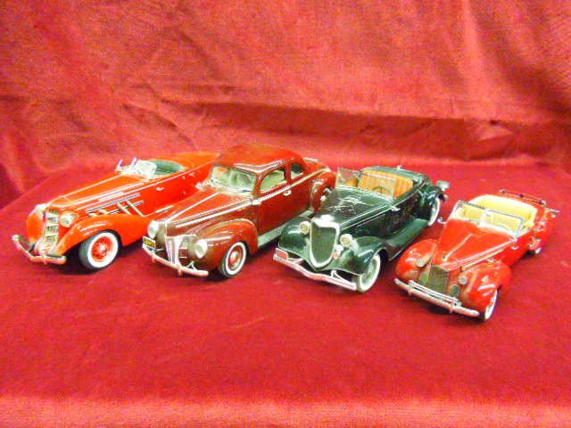 Four Die Cast 1940's Cars: Lot of 4 die cast 1940's cars; (1) 1940 Ford Coupe by Ertyl, (1) Ford V-8 by Solido (1) 1940 Packard by the Franklin Mint, (1) 1935 Auburn Speedster by Ertly. Condition: No issues noted.