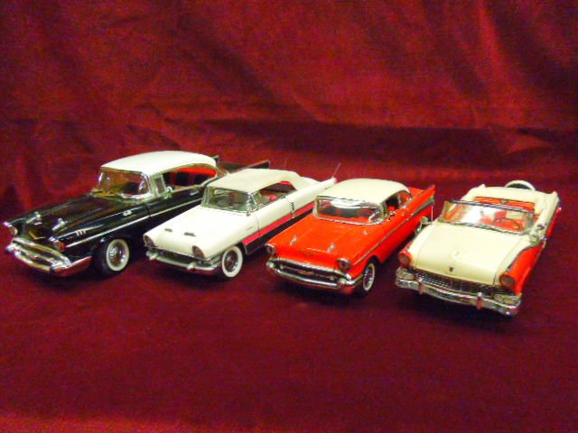 Four 1950's Die Cast Cars: Lot of four 1950's Die cast cars: (1) Ertyl 57' Chevy, (1) Franklin Mint 1955 Packard, (1) Franklin Mint 57' Chevy, (1) Danbury Mint 1956 Ford Sunliner. CONDITION: No issues noted.