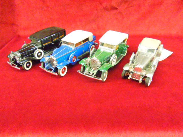 4 Die Cast Touring Cars: Lot of 4 die cast touring cars (1) 1932 Cadillac, (1) 1933 Dusenberg SJ Twenty Grand, (1) 1930 V-16 Cadillac From The Franklin Mint & (1) 1932 V-16 Cadillac. CONDITION: Some wear from age minor parts 