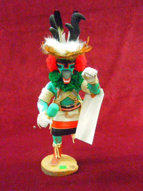 Hopi Kachina Doll (Antelope): Contemporary S.W. Hopi Kachina doll; "Chof" ( antelope) with rattle, artist signed "F (rances) Largo, hand carved, polychrome hand painted with fur, feathers, yarn & seashell double strap on chest, 11