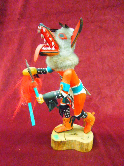 Hopi Kachina Doll (Wolf): Contemporary S.W. Hopi Kachina doll "Kweo" (wolf) with staff & rattle, artist signed "Tony Dukepoo" hand carved, polychrome hand painted with fur, feathers & yarn, 14 1/4" h. CONDITION: Reglued to bas