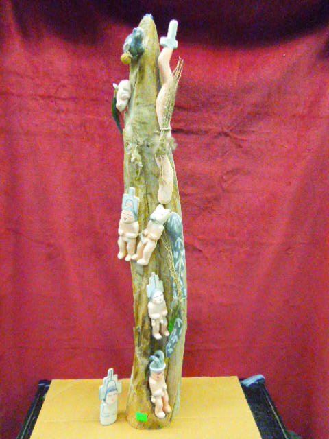 5 Figure Kachina Doll Totem: Contemporary five figure S.W. Hopi Kachina doll totem, with snake, ram head & frog figures, on cotton wood branch, hand carved, polychrome hand painted, turquoise stones on top, 42"h. CONDITION: One K