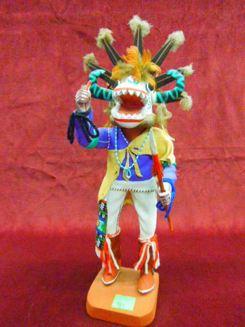 Hopi Kachina Doll "Tahaum Soyoko": Contemporary S.W. Hopi Kochina doll "Tahaum Soyoko" with spear & dagger, artist signed "H (enry) Shelton" Oraibi, Ariz., hand carved, polychrome hand painted with feathers & leather cape, beaded neckl