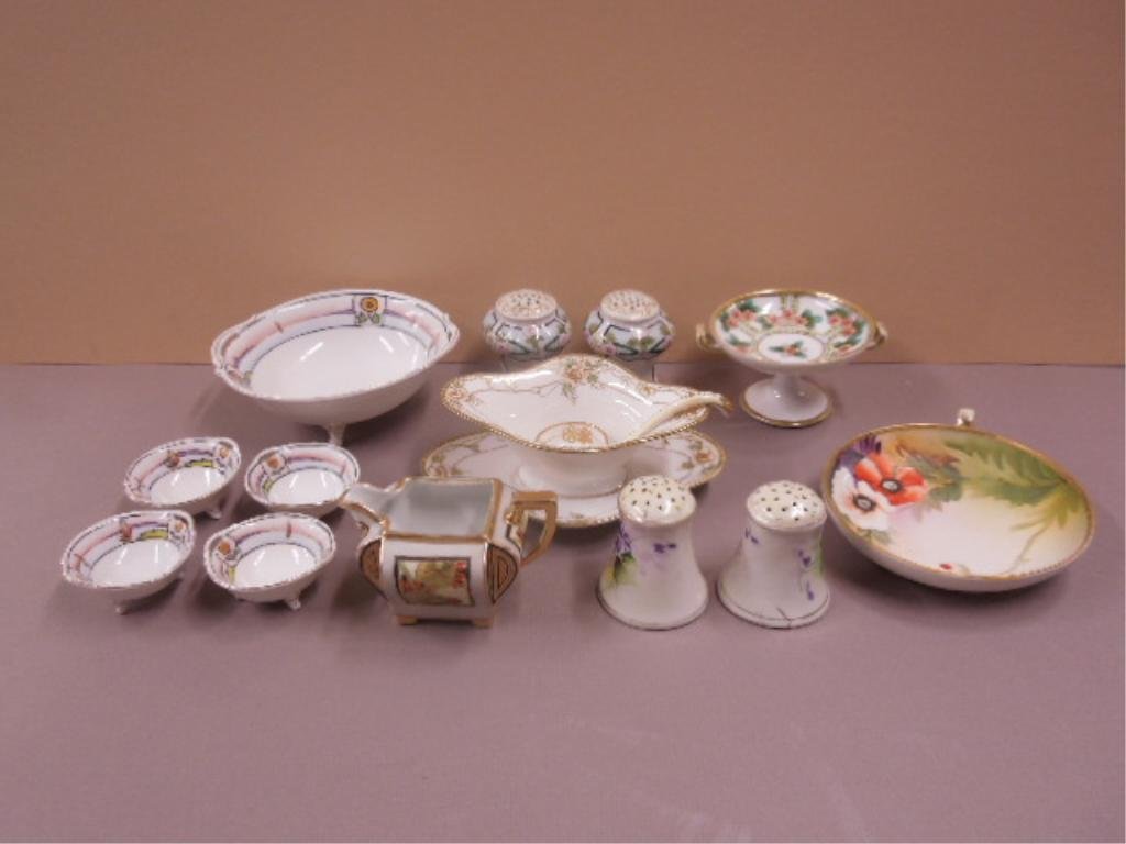 (16) Pieces Hand Painted Nippon Porcelain: (16) Pieces hand painted Nippon porcelain; includes: gravy boat, tray & ladle; 2 pair salt & pepper, small Tazza, nappy, 5 pieces nut dish set, creamer, early 20th C. CONDITION: Good.
